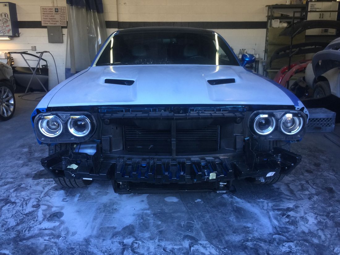 Dodge Challenger with front bumper removed during collision repair